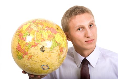 Young man holding globus made of puzzlesの写真素材