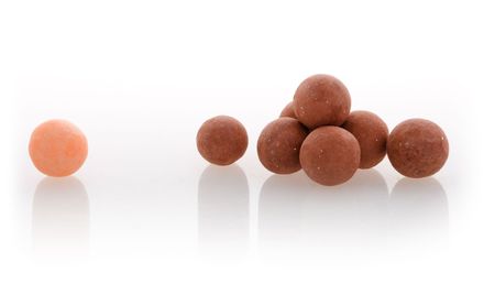 Close-up of face powder balls on isolated backgroundの写真素材