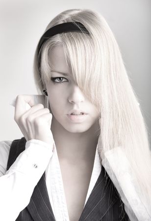 Portrait of young woman in white shirtの写真素材