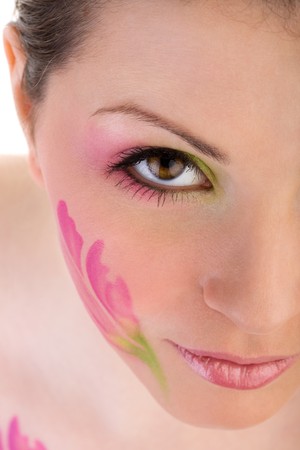 Closeup photo of woman face with paintingの写真素材