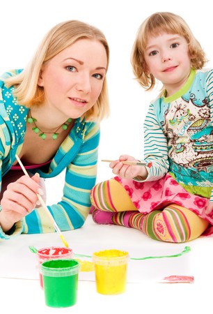 Mother and daughter painting together on isolated white backgroundの写真素材