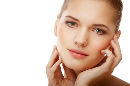Closeup beauty portrait of a young woman over isolated whiteの写真素材