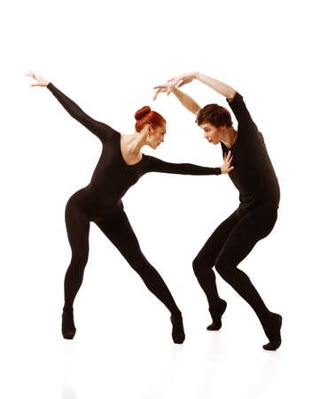 Couple of ballet dancers posing over isolated white backgroundの写真素材