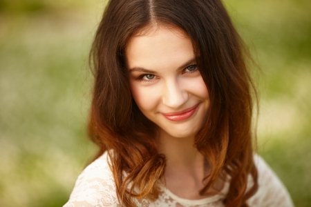Portrait of attractive young girl on a sunny summer dayの写真素材