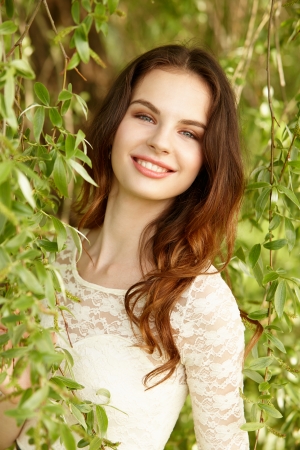 Portrait of attractive young girl on a sunny summer dayの写真素材