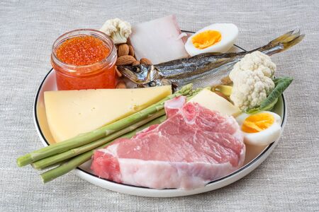 Selection of good fat sources of ketogenic diet products on a linen fabric background.の写真素材
