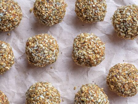 Top view of Low-fat energy balls with nuts on paperの写真素材