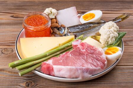 View of ketogenic diet products on a wooden background.の写真素材