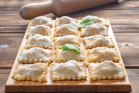 Perspective View of Fresh Homemade Ravioli on Wooden Background. Soft focus.の写真素材