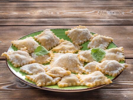Close Up View of Fresh Homemade Ravioli on Wooden Background. With copy space. Soft focus.の写真素材