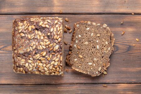 Brown Homemade Bread on wooden backgroundの写真素材
