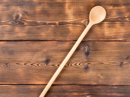Wooden spoon on wooden backgroundの写真素材