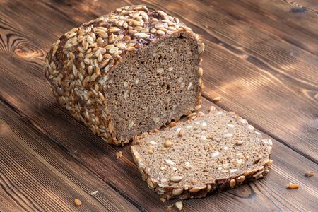 Close up View of Brown Homemade Bread on wooden background.の写真素材