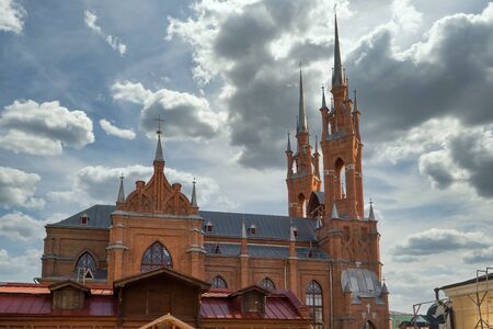 Side view of The Sacred Heart Church against dramatic cloudy sky.のeditorial素材