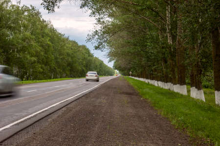 Summer view of asphalt straight road way.の写真素材