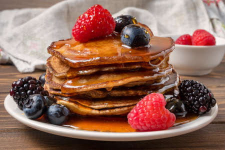 Pancakes with berries and honey. Soft focusの写真素材