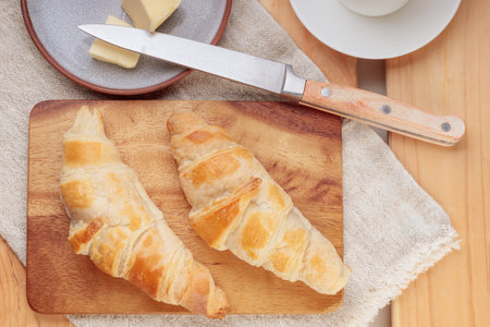 Composition with homemade croissants on a wooden board.の写真素材