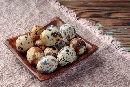 Close-up view of Quail eggs on wooden backgroundの写真素材