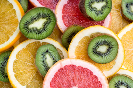 View of oranges, kiwi, grapefruit backgroundの写真素材