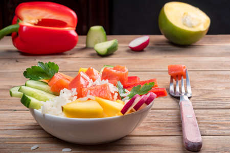 Poke salad from hawaii with vegetables. To prepare it just take rice, salmon and any vegetables.の写真素材