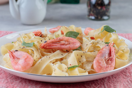 Pasta fettuccine with shrimp in ceramic plate.の写真素材