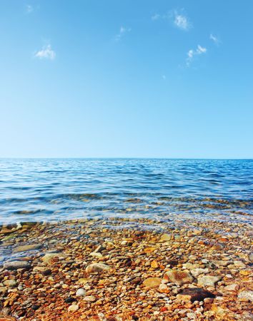 Transparent sea water and blue skyの写真素材