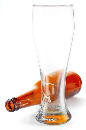 Empty beer bottle and glassの写真素材