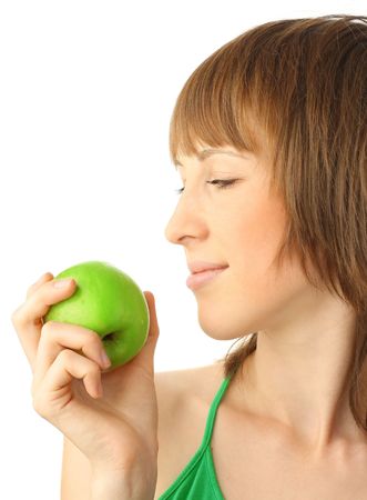 Young smiling woman with green appleの写真素材
