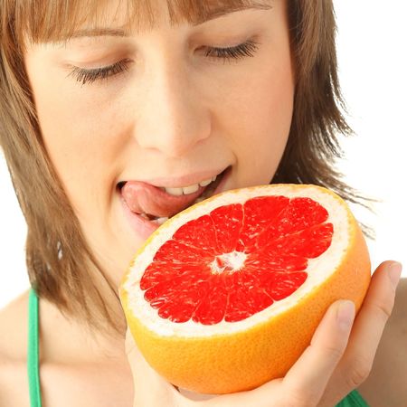 Young woman with tropical fruitの写真素材