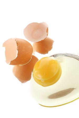 Broken egg on white background