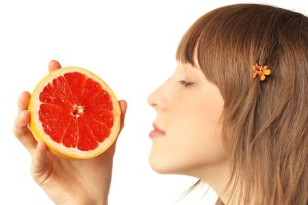 Young woman with grapefruit's slicesの写真素材