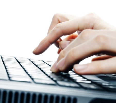 Hands over computer keyboardの写真素材