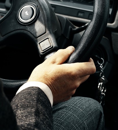 Hand on steering wheelの写真素材