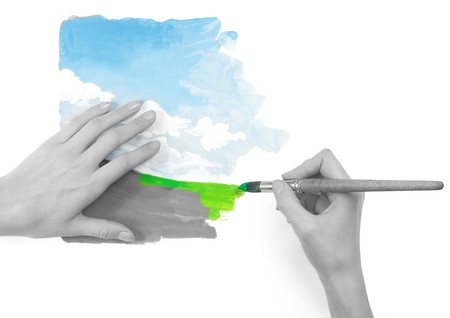 Hands with brush and bright nature imageの写真素材