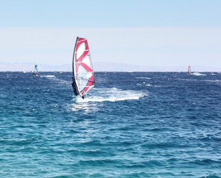 Windsurfers on blue seaの写真素材