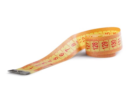 Textile orange ruler with red marks over white backgroundの写真素材