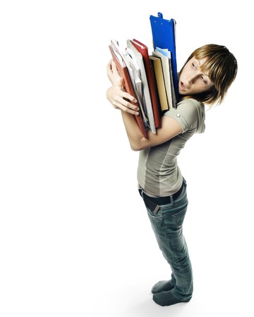 Young woman with heap of papers over white backgroundの写真素材