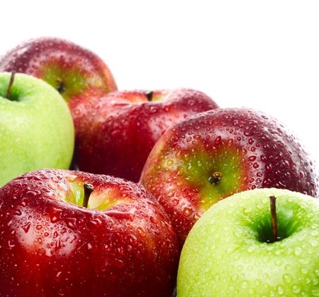 Green and red apples on white backgroundの写真素材
