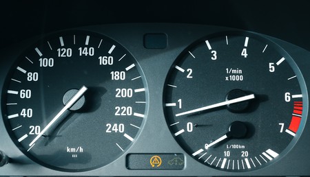 Car dashboard with speedometer (km/h) and tachometerの写真素材