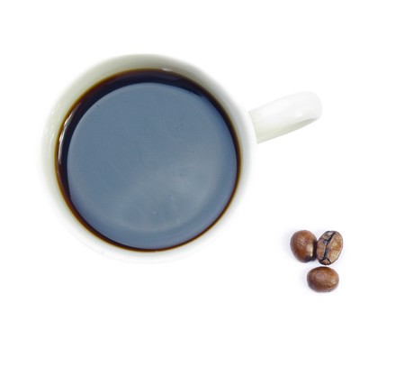 Cup with coffee on and beansの写真素材