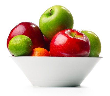 Fruits in deep plate over whiteの写真素材