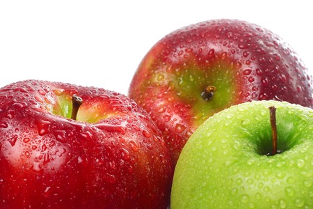 Green and red wet applesの写真素材