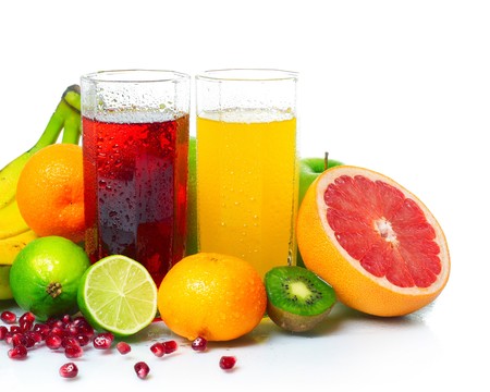Wet ripe fruits with juice glasses on white backgroundの写真素材