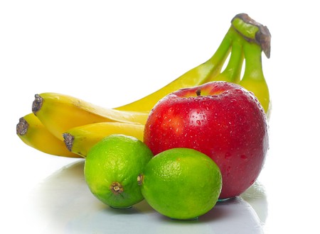 Wet tropical fruits over whiteの写真素材