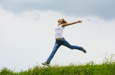 Young jumping womanの写真素材
