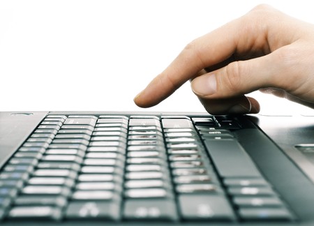 Finger above computer keyboardの写真素材