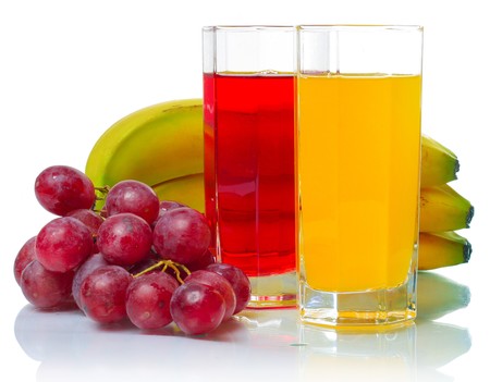 Tropical fruits with glasses over whiteの写真素材