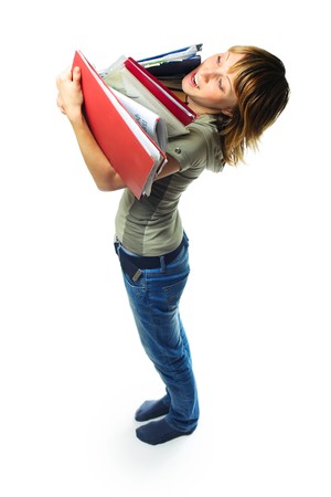 Young woman with heap of papers over whiteの写真素材