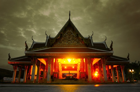 Ancient praying building at night with dark cloudsの写真素材