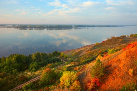 Big river Kama in sunrise light with autumn trees on a coast.の写真素材
